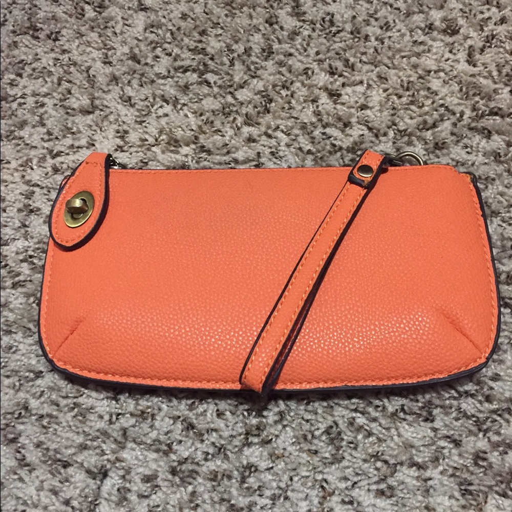 Small orange hand clutch